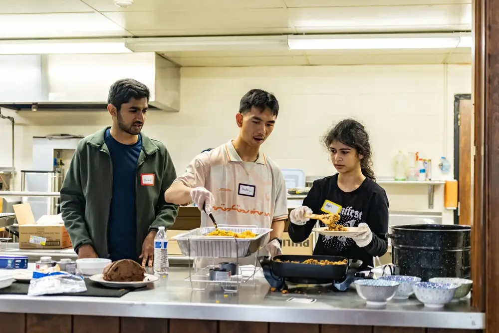 Foodways contributors preparing a shared meal together