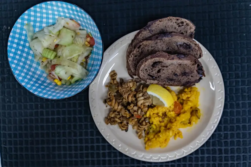A prepared meal with vegetables, rice, and bread at the Neighborhood House health fair