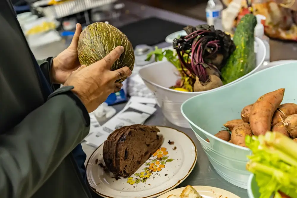Preparing fresh produce for the shared meal.
