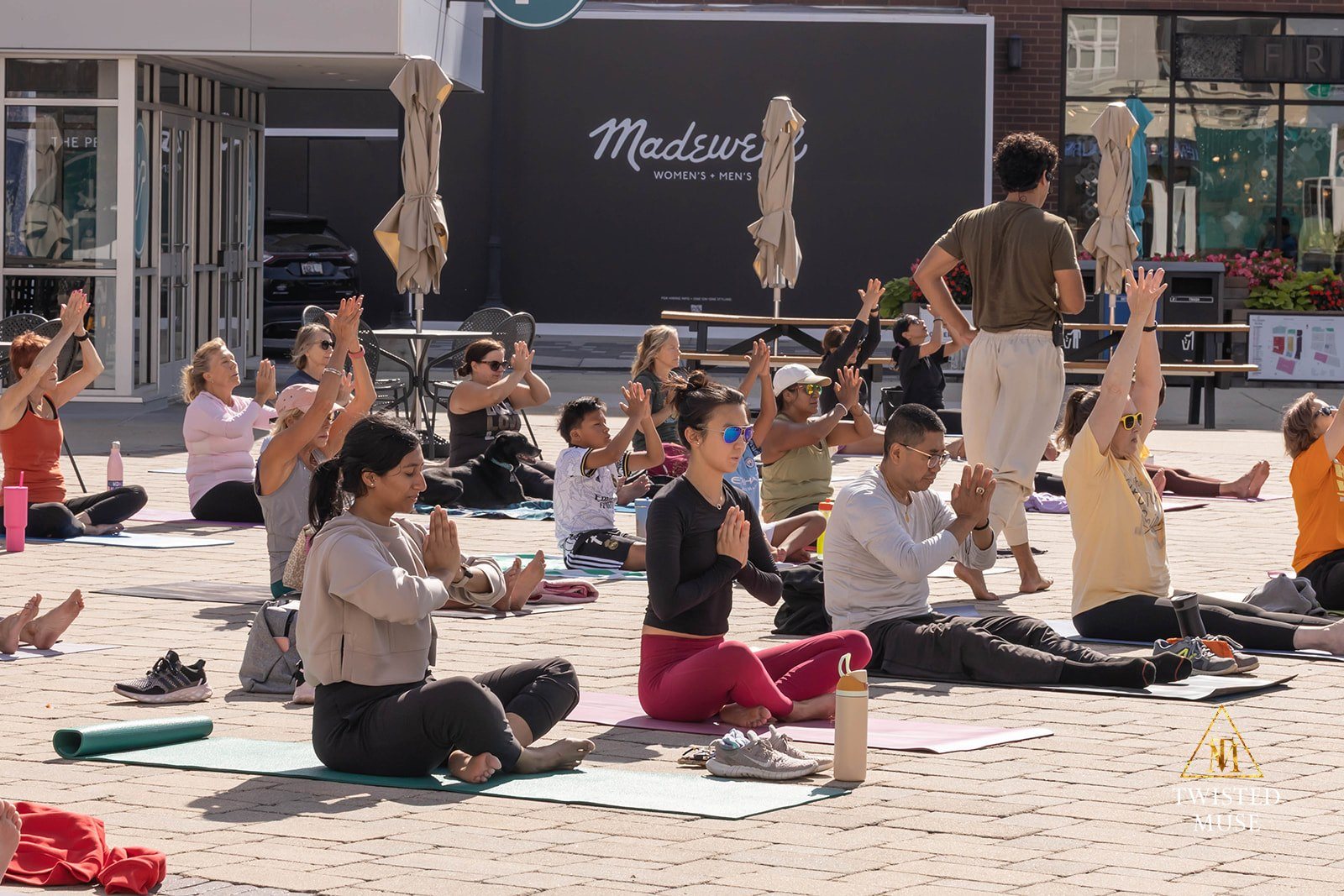 Senses Yoga School teaching in a public outdoor setting